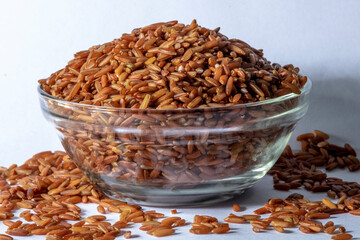 red integral rice on glass bowl isolated on white background in Brazil