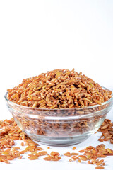 red integral rice on glass bowl isolated on white background in Brazil