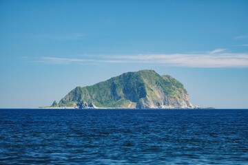 Fototapeta na wymiar Keelung Seascape - Famous Keelung Islet with morning blue bright sky, shot from Daping Coastal in Zhongzheng District, Keelung, Taiwan.