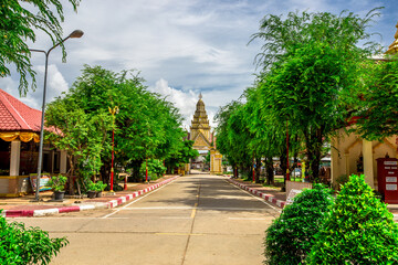 Background of an important tourist attraction in Khon Kaen, where tourists come to see the beauty always (Phra That Kham Kaen) is an old pagoda and has a beautiful golden yellow color, in Thailand