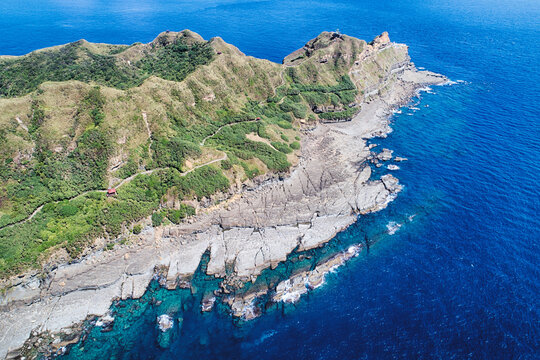 Cape Bitoujiao Aerial Photography - Taiwan Northeast corner birds eye view use the drone photography, on sunny day with blue ocean, shot in Cape Bitoujiao, Ruifang District, New Taipei, Taiwan.
