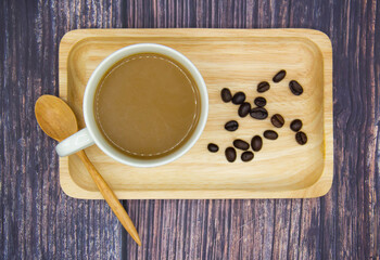 A cup of coffee on wood tray