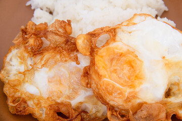 Crispy fried eggs with rice, thai style fried egg