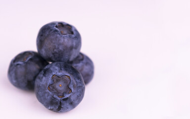 Blueberries on a white background.
Close-up. Copy space.