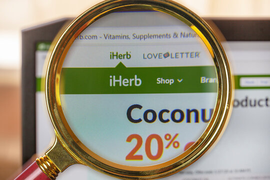 a search engine for поиска товаров around the world "iherb.com", close-up under a magnifying loupe