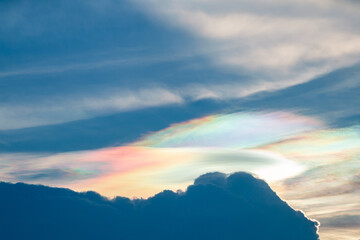 Fototapeta na wymiar Beautiful Iridescent Pileus cloud in the evening.Rainbow cloud background.