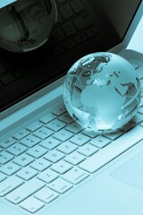 Glass Globe On Laptop Keyboard Close-up