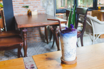 Butterfly pea juice and milk in a glass