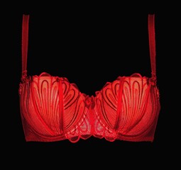 Red fashion lace bra on a black background.