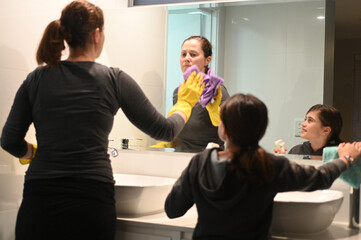 Mother and Daughter cleaning together