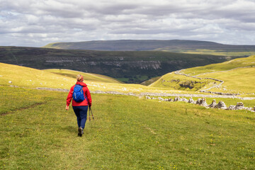 Female hiker on the trail heading to Arncliffe in the Yorkshire Dales