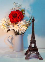 Fototapeta na wymiar Paris Eiffel Tower Concept With Fresh Rose Flowers
