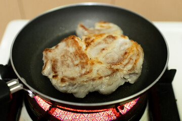 Grilled pork on pan. Homemade cooking.