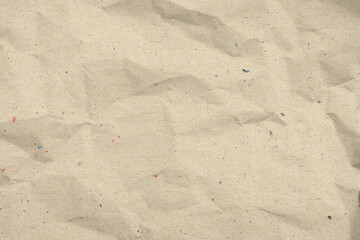 Recycled brown creased paper background or cardboard surface from a paper box for packing.for the...