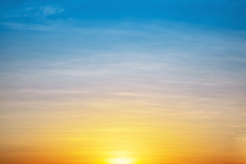 The morning sun under the colorful sky, warm horizon line