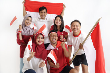 group of indonesian supporter celebrating victory together over white background. people holding...