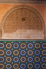 Fototapeta na wymiar Details of a wall inside the Ben Youssef Madrasa