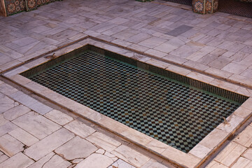 A pool  inside the Ben Youssef Madrasa