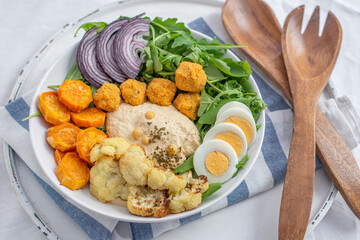 healthy home made avocado hummus salad bowl