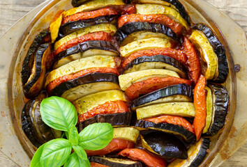 Traditional french dish ratatouille. Vegetable casserole with eggplant, tomato and zucchini in a...