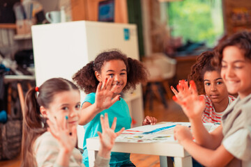 Kids stained their fingers while painting with watercolors