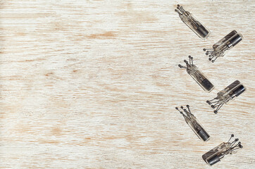 small vacuum glass electronic retro light bulb on the wooden background