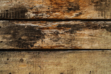 Very old decaying planks damaged by weathering