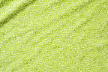 Green towel fabric texture surface close up background