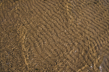 sand waves pattern under the water
