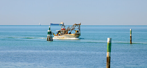 Fishing boat returning home at Adriatic sea