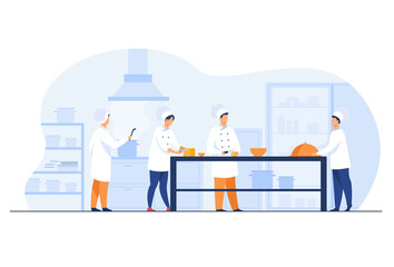 Chefs, cooks and waiters working at restaurant kitchen isolated flat vector illustration. Cartoon professional and commercial cooking process. Hospitality and food concept