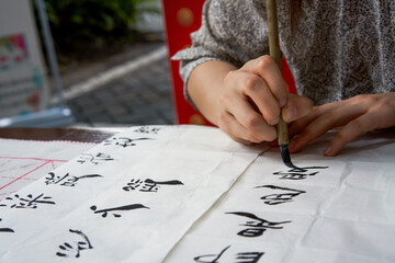 A calligrapher is creating calligraphy and writing calligraphy