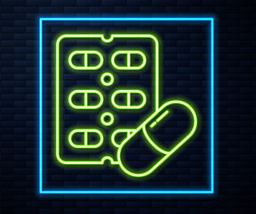 Glowing neon line Pills in blister pack icon isolated on brick wall background. Medical drug package for tablet, vitamin, antibiotic, aspirin. Vector Illustration.