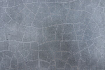 Light gray concrete and lines of crack surface, smooth light gray cement background.