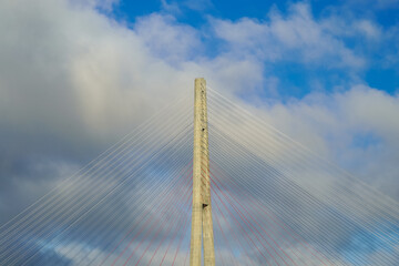 Fototapeta premium Pylons of the Russian bridge against the blue sky.