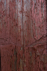 texture of the old board. peeling red paint with chips