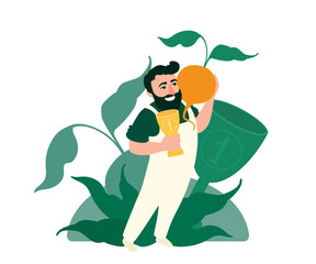 Giant vegetables championship winner. Champion of the tournament holds a big turnip and a goblet. First place cup. A proud gardener smiling.