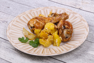 Roasted chicken legs with potato