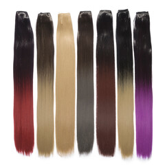a collection of different colors of clip in straight synthetic hair extensions