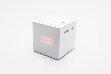 White, square digital clock on white background with clipping path.