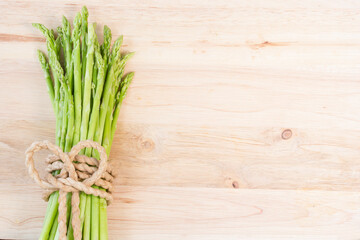 Bunch of fresh green asparagus spears tied with string