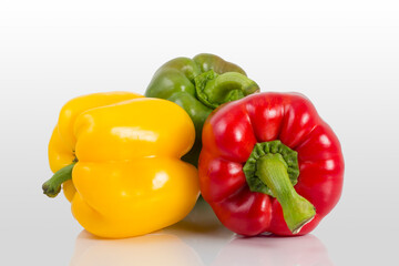 three fresh sweet pepper isolated on white background