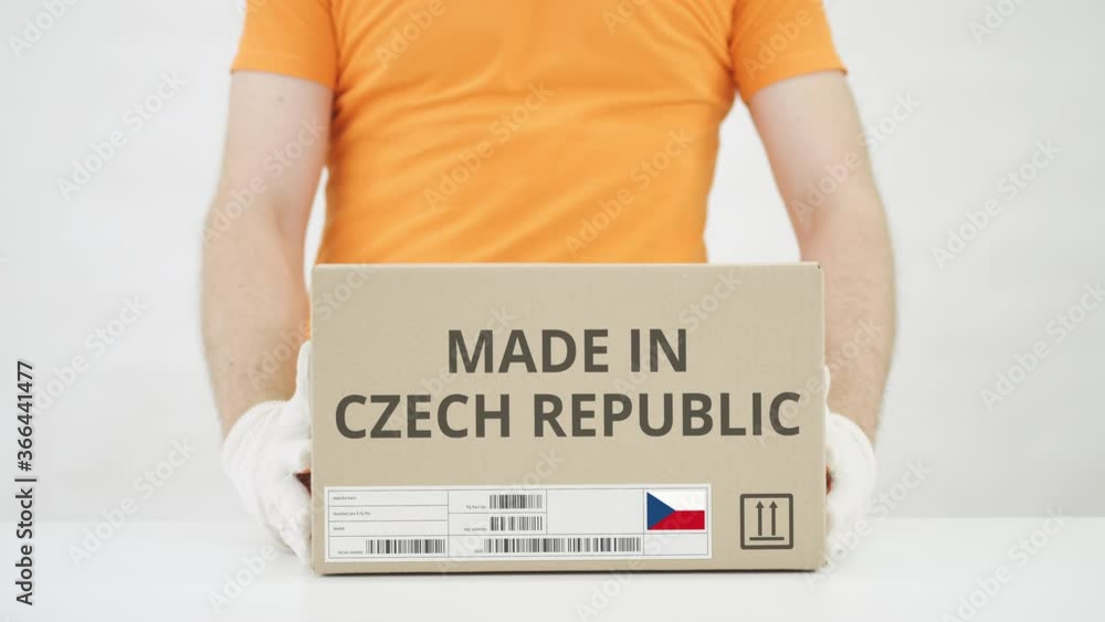 Poster man puts cardboard box with made in czech republic text on the table