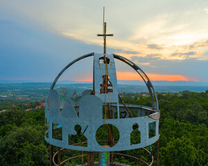 Abandoned geodetic tower with Hungairan crown on top. Near by Budapest, Hungary. Originally this was a geological measuring station. Today just only one abandoned tower next to Szada town
