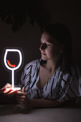 Beautiful girl with a glass of wine neon sign. Trendy stylish. Glowing life. Modern style. Neon sign.