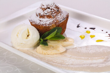 Tasty hot muffin with ice cream