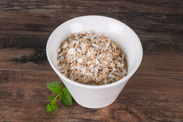 Raw oats in the bowl