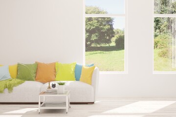 White living room with sofa and summer landscape in window. Scandinavian interior design. 3D illustration