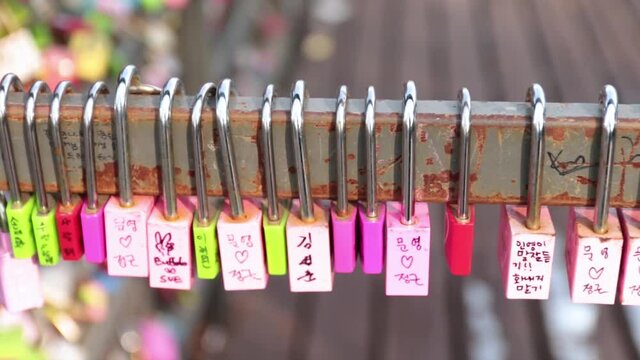 Seoul,South Korea-October 2017: Close up image of love locks hanging at a fence. Love padlocks hanging at Namsan Seoul Tower.