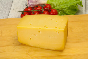 Hard yellow tasty cheese brick